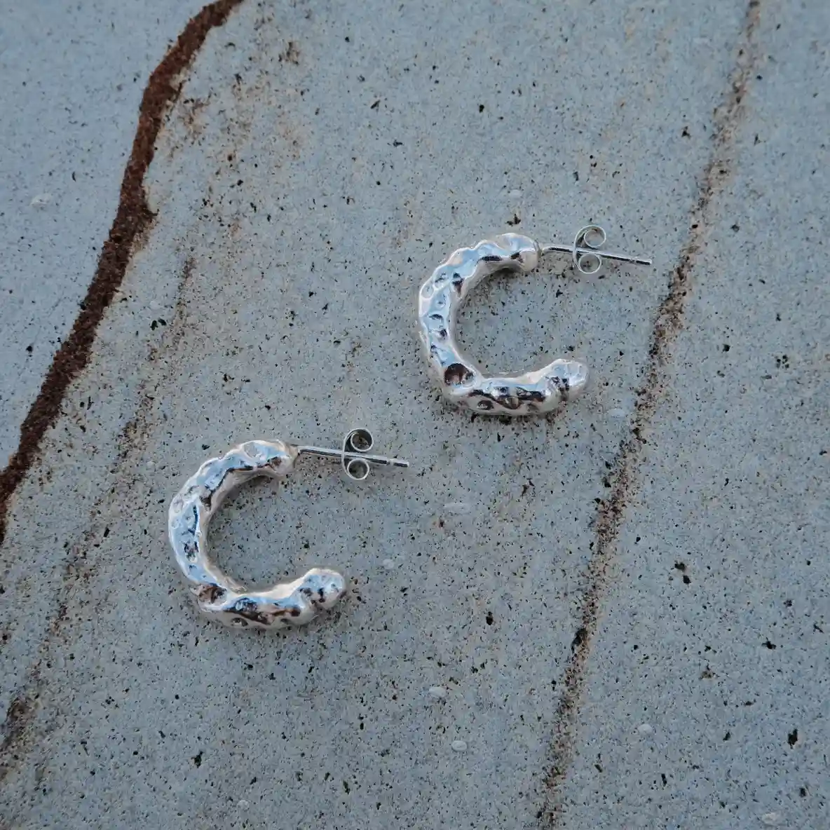Handmade textured sterling silver hoop earrings with raw organic finish, small 925 silver studs